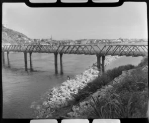 Whitebaiting on the Grey / Mawheranui River at Greymouth, includes railway bridge, river and township.