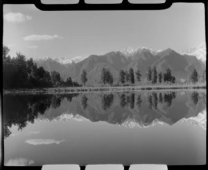 Lake Matheson, includes bush, flax plants and mountains, West Coast Region