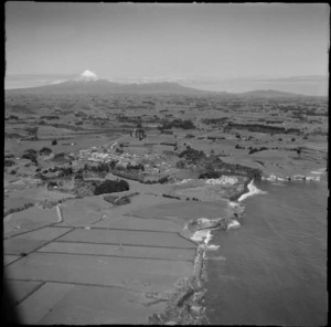 View of the north New Plymouth coastal settlement of Urenui with Mount Taranaki beyond, North Taranaki Region