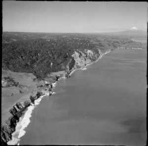 View to the White Cliffs and the peninsula settlement of Pukearuhe south along the Taranaki coastline back to Mount Taranaki, North Taranaki Region