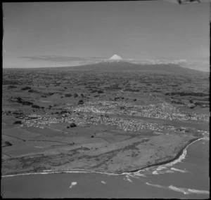 View of the north New Plymouth coastal town and river of Waitara with Mount Taranaki beyond, North Taranaki Region