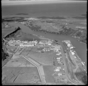 Close-up of the Patea Freezing Works and River Estuary with railway yards and wharf area, South Taranaki Region