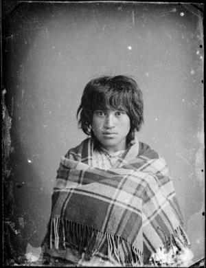 Unidentified young Maori woman wrapped in a blanket