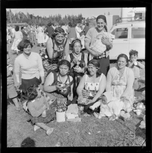 Maori wahine and children sampling kai at the Ohakune Railway Jubilee Celebrations