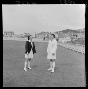 Two unidentified women [captains?] from the New Zealand and English national women's cricket teams, tossing a coin [Basin Reserve, Wellington?]