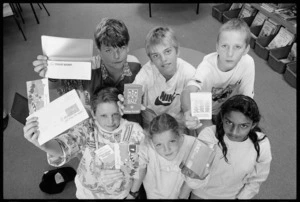 Kelburn school children holding bank books - Photograph taken by John Nicholson