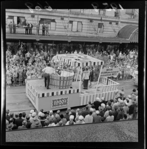 Festival of Wellington parade, showing a 1920s nostalgia float, and onlookers, outside the DIC building, Lambton Quay, Wellington