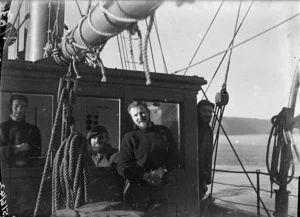 Coastwatchers aboard a vessel in the harbour, Auckland Islands