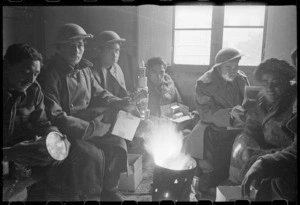 New Zealand soldiers of Maori Battalion with Christmas parcels, Italy, during World War 2