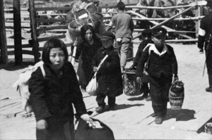 Korean children carrying their belongings