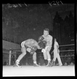Boxing match, showing unidentified boxers and crowd, Wellington Town Hall