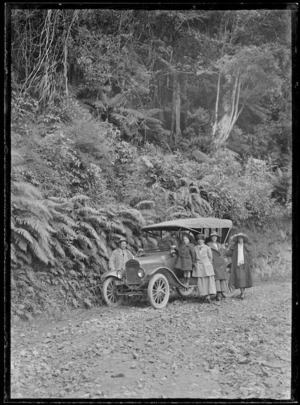 Group with car, Christmas Day, on the Waikanae to Akatarawa Road, Wellington region