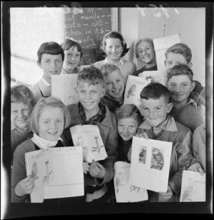 Schoolchildren with drawings and stories about a morepork, Korokoro School, Wellington
