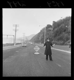 Senior traffic officer H F Gilligan watching traffic on the Hutt Road, Wellington region