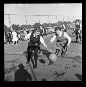 Basketball match, Wellington East Girls' College versus Onslow College, showing unidentified players and spectators