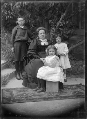 Phyllis and William Godber with their grandmother Mary Ann Godber, and cousin Constance Alice Godber, in 1908.
