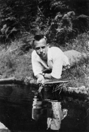 Frank Sargeson beside water trough