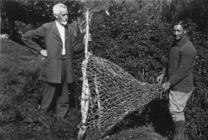 Elsdon Best and Teko Chadwick holding a fishing net