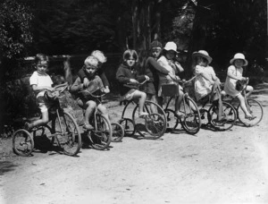 Group of children on tricycles