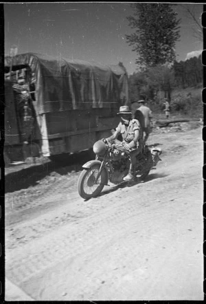 World War II New Zealand Army despatch rider on a motorcycle, Italy - Photograph taken by George Frederick Kaye