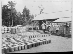Concrete blocks, and workers alongside, Taihape district