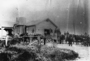 Dairy factory at Hiwinui, Manawatu, with horse and carts alongside