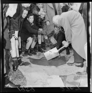Walter Nash, assisted by unidentified schoolchildren, planting a tree on Arbour day, location unidentifiied