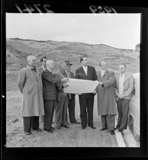 The Mayor of Wellington, Frank Kitts, viewing new subdivision at Karori, with a group of unidentified men