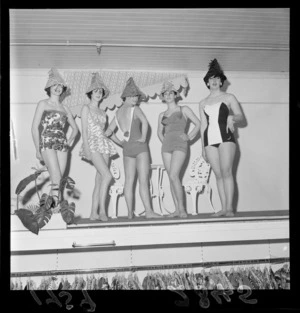 Four unidentified women on a catwalk, modelling swimsuits, at Kirkcaldie & Stains Ltd department Store, Wellington City