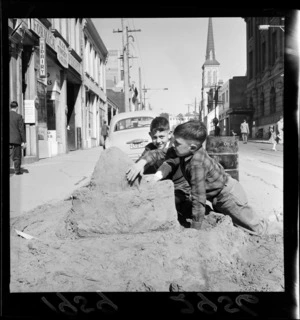 Unidentified boys building a sand castle in Willis Street, Wellington