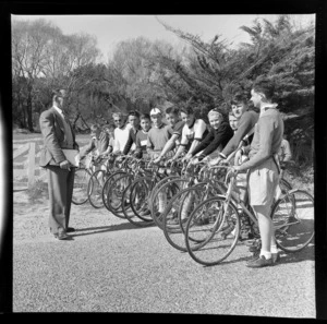 Road cycling competition, unidentified man and young competitors, waiting at starting line, unidentified location