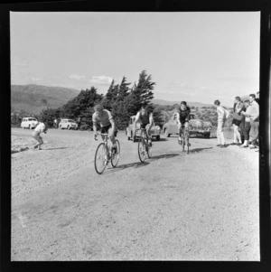 Road cycling competition, unidentified cyclists passing spectators, unidentified location