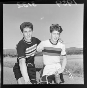 Two unidentified young men, competitors of the road cycling competition, unidentified location