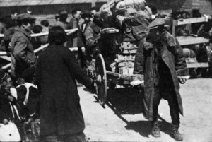 Korean repatriates and cart loads of their belongings