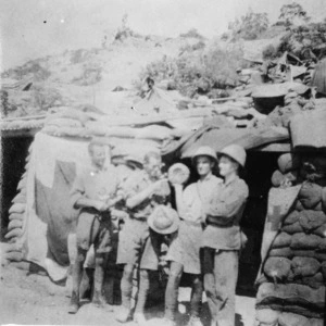 Four New Zealand soldiers outside dug-out, Gallipoli, Turkey