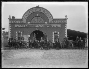 Men with horse drawn carts alongside the Canterbury Carrying Company/Yeovil Livery and Bait Stables building, St Asaph Street, Christchurch