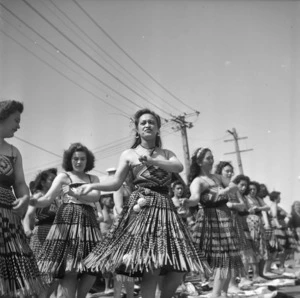 Women performing waiata to welcome home the Maori Battalion after World War II