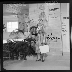 Fashion at DIC spring to summer 1959 with an unidentified model in store, Wellington City