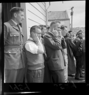 Crowd of unidentified people watching Vampire jet NZ5751 take off at Clyde Quay wharf, Wellington.