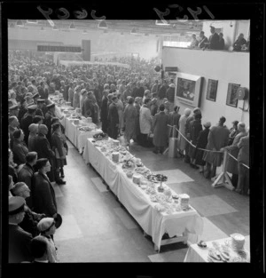 Official opening event inside the terminal at Wellington airport, includes unidentified crowd, banquet table with food