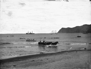 Scene at Waipiro Bay with ships and horse drawn cart