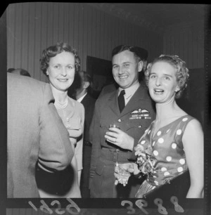 Group of unidentified guests at cocktail party, at UK High Commissioner's home for visiting airmen (Blue Domino)