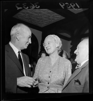 Reception for visiting members of the air forces, showing two men and a woman, all unidentified, at Homewood, Karori, Wellington