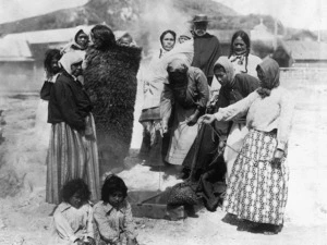 Unidentified Maori group, steaming baskets of food