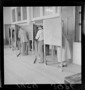People in voting booths, during [mayoral ?] elections, unidentified location