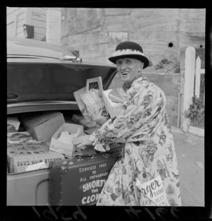 Portrait of the Clown 'Shorty' with his car boot open, street hill location unknown, Wellington Region