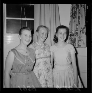 Ballet dancers at a Christmas party showing three unidentified young women at an unknown indoor location, Wellington Region
