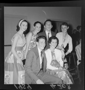 Ballet dancers at a Christmas party with group of unidentified young people at an unknown indoor location, Wellington Region
