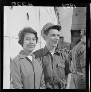 Malayan bride Sylvia with her husband Private Harry Newman, at Glasgow Wharf, Wellington, after the return of the New Zealand Army from Malaya