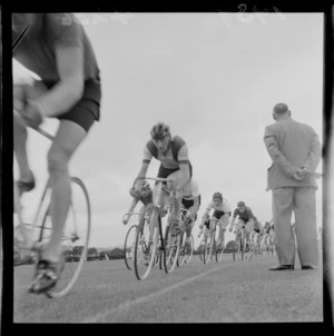 Group of unidentified cyclists racing, at an Athletics meeting, Laycold Cup, probably in Wellington